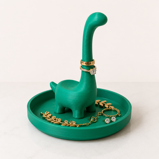 Bright green 3D printed Ringosaurus dinosaur ring holder with jewelry tray displaying rings and earrings