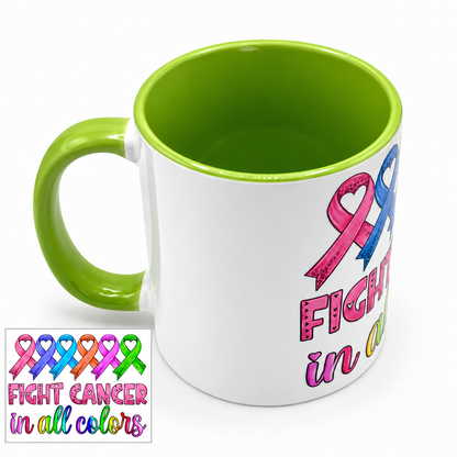 White cancer awareness mug with colorful ribbons, “Fight Cancer in All Colors” design, and a green interior and handle.